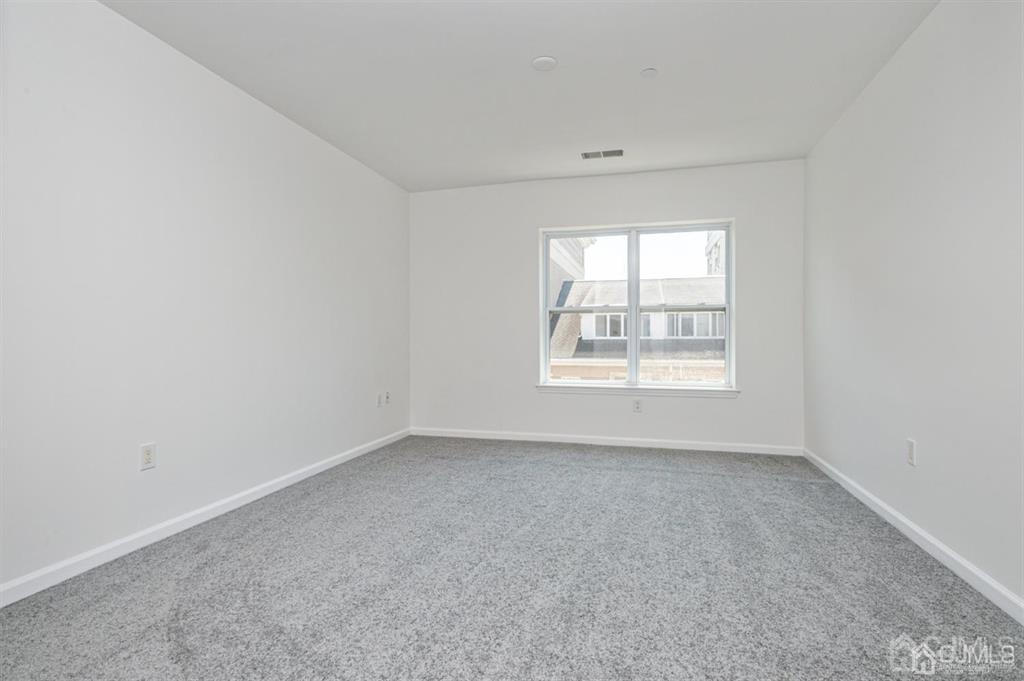 368 Rector Street, Unit 514 Perth Amboy, NJ 08861 - Photo 15 of 24 an empty room with windows