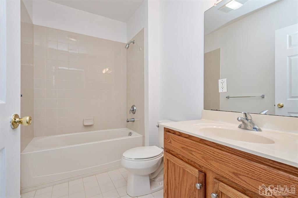 368 Rector Street, Unit 514 Perth Amboy, NJ 08861 - Photo 20 of 24 a bathroom with a sink a toilet and shower