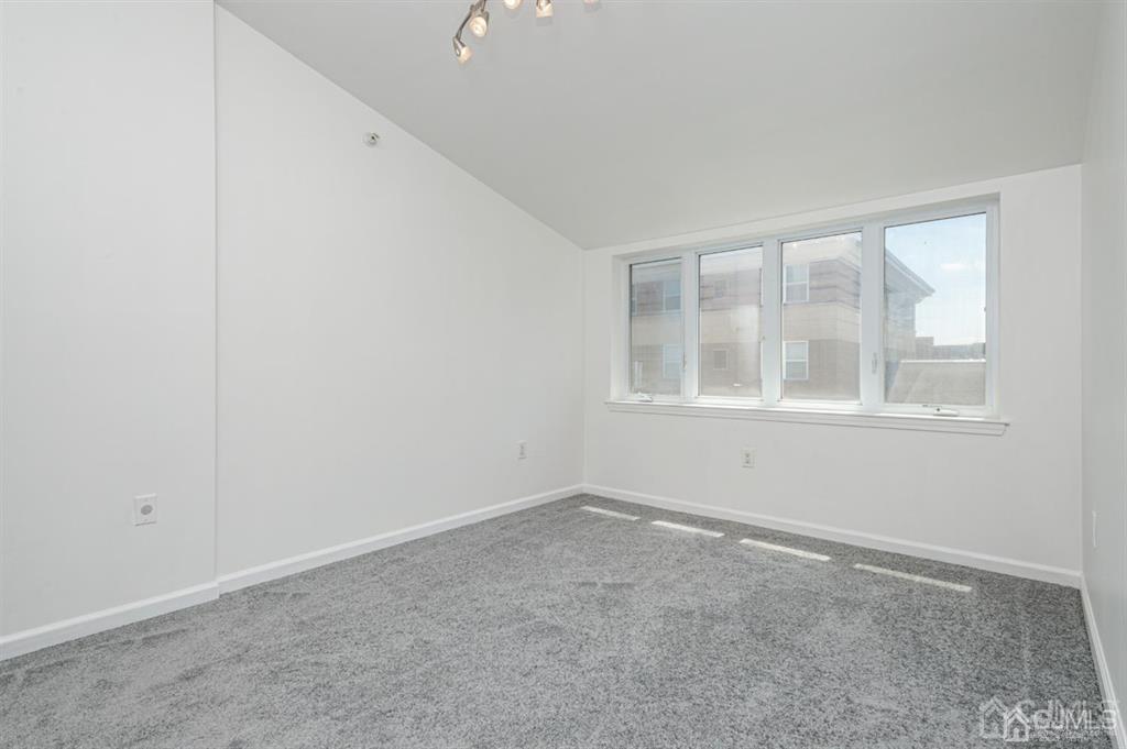 368 Rector Street, Unit 514 Perth Amboy, NJ 08861 - Photo 3 of 24 an empty room with a window