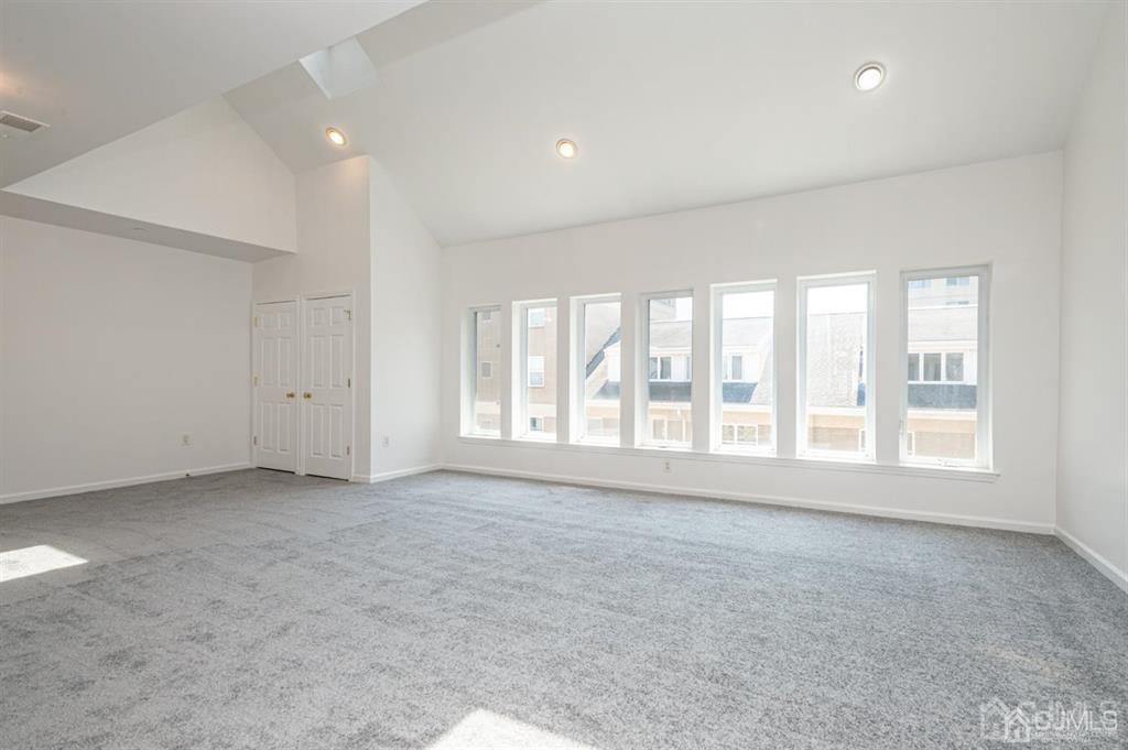 368 Rector Street, Unit 514 Perth Amboy, NJ 08861 - Photo 4 of 24 an empty room with windows