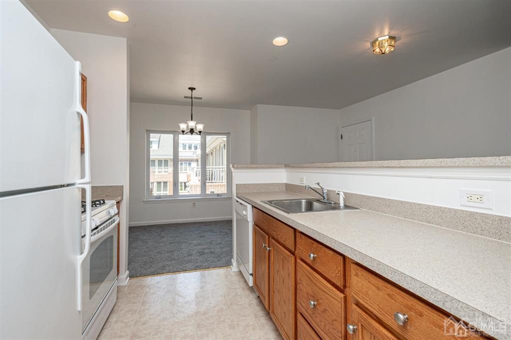 368 Rector Street, Unit 514 Perth Amboy, NJ 08861 - Photo 8 of 24 a spacious bathroom with a granite countertop sink a mirror and a bathtub