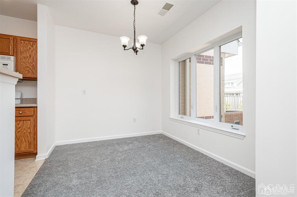 368 Rector Street, Unit 514 Perth Amboy, NJ 08861 - Photo 9 of 24 a view of an empty room with a window