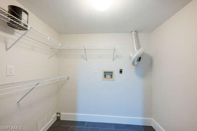 140 Cypress Way East, Unit 601 Naples, FL 34110 - Photo 16 of 27 a view of small space with racks on the wall
