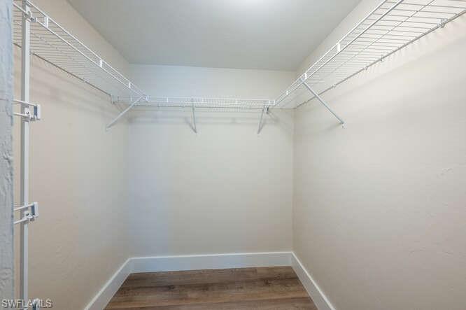 140 Cypress Way East, Unit 601 Naples, FL 34110 - Photo 17 of 27 a view of a room with racks on the wall