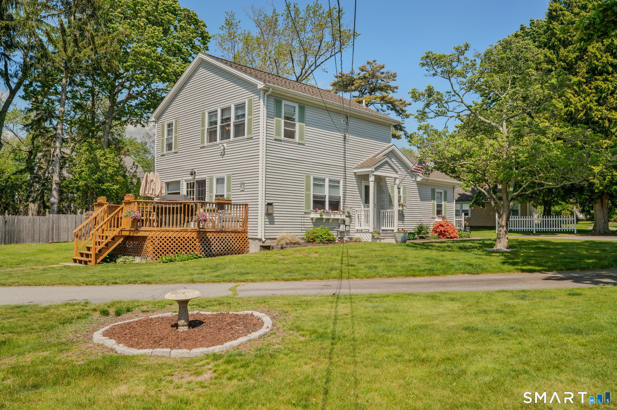 212 R Shore Road Waterford, CT 06385 - Photo 3 of 28 a backyard of a house with table and chairs
