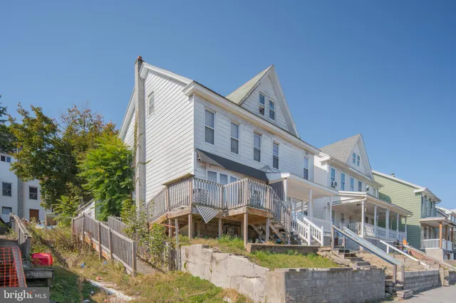 a view of a building with a yard