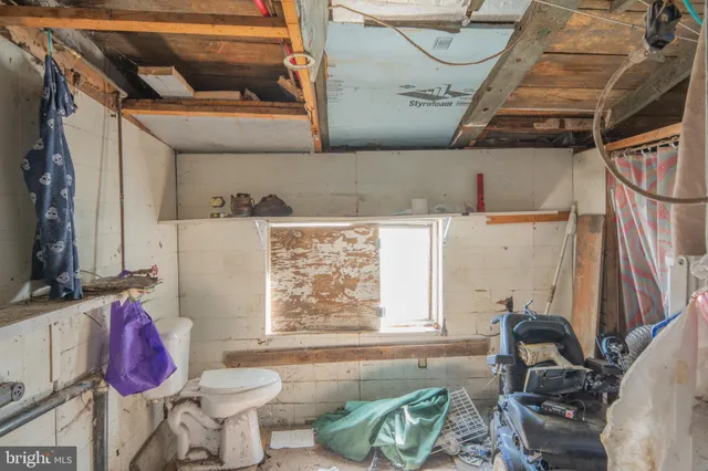 a bathroom with a sink toilet and tub