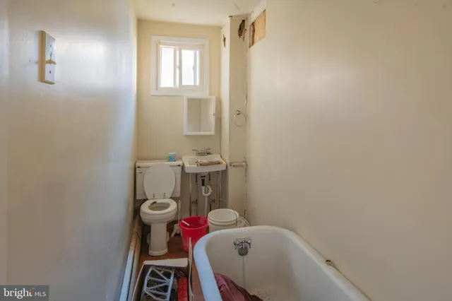 a bathroom with a sink and toilet
