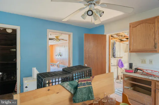 a bedroom with furniture and a chandelier
