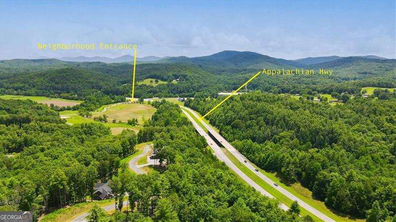 0 Ridge Drive, Unit LOT #64 Morganton, GA 30560 - Photo 6 of 15 a view of a lush green field with mountains in the background