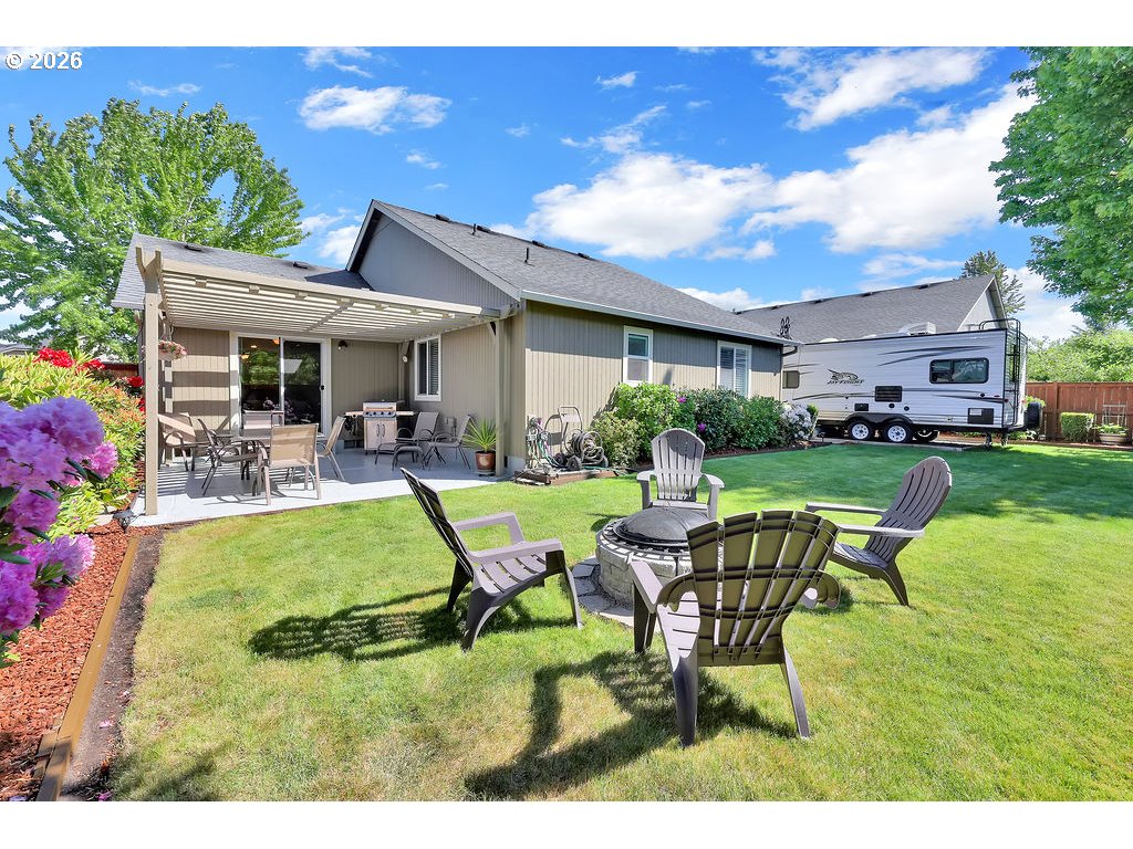 87836 8th Street Veneta, OR 97487 - Photo 3 of 25 a swimming pool with outdoor seating and yard