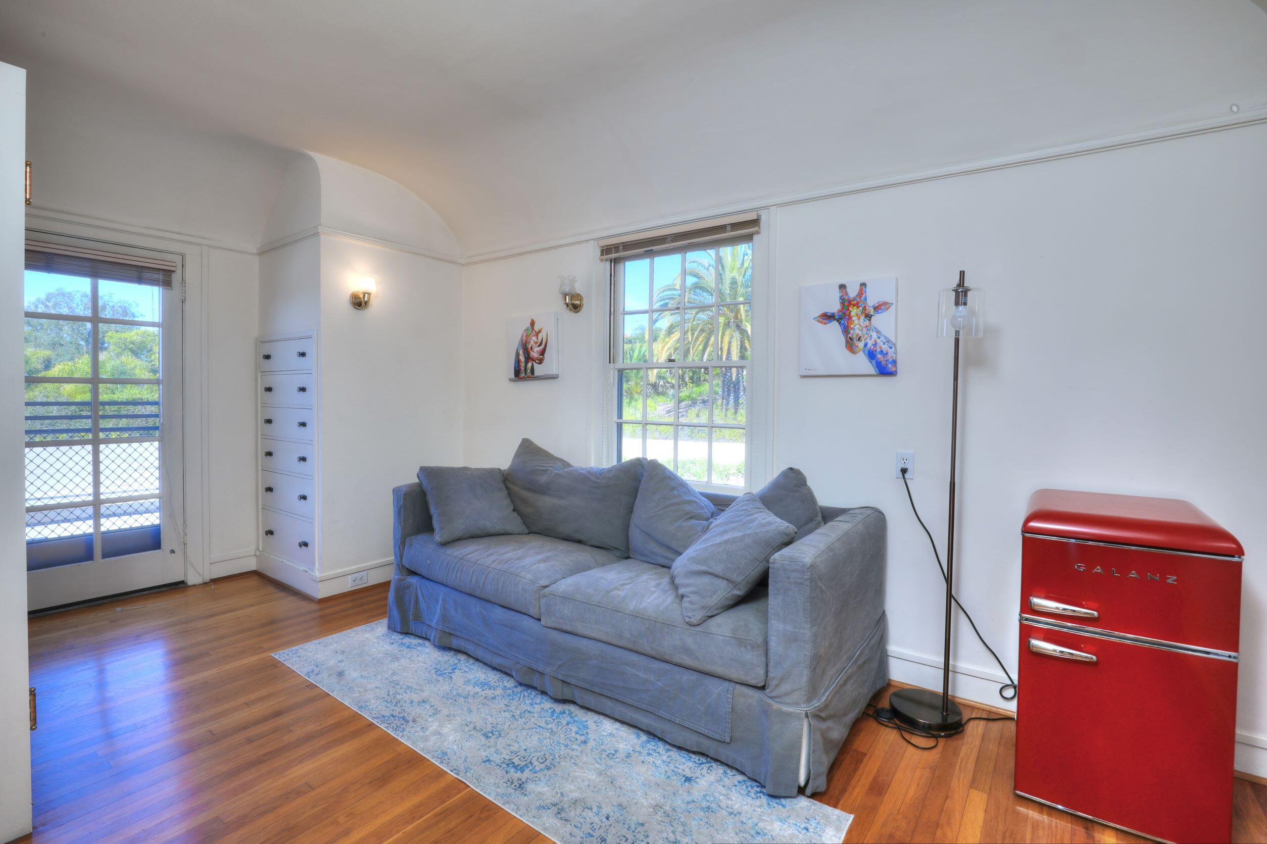 1713 Lasuen Road Santa Barbara, CA 93103 - Photo 16 of 20 a living room with furniture and wooden floor
