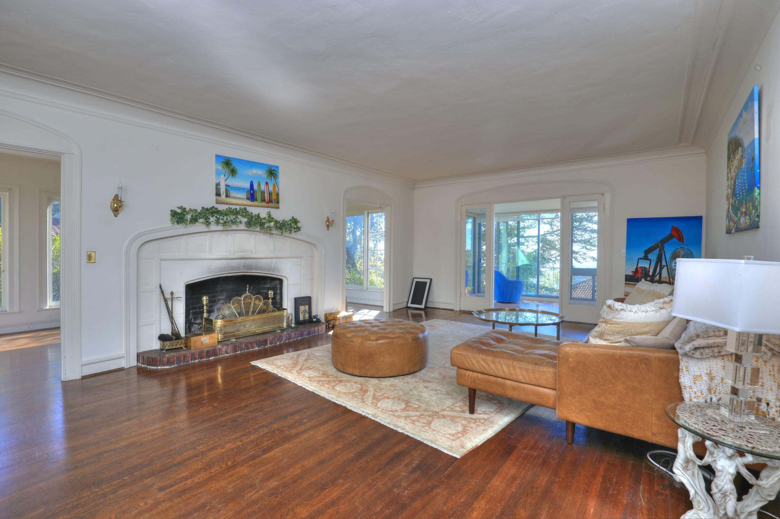 1713 Lasuen Road Santa Barbara, CA 93103 - Photo 6 of 20 a living room with furniture and a fireplace