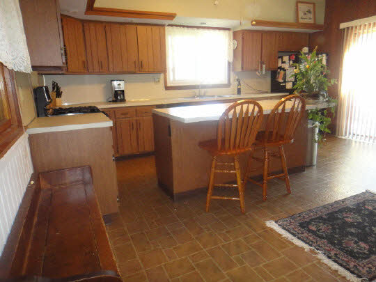 4007 East Lamm Road Freeport, IL 61032 - Photo 11 of 11 a kitchen with a sink a window and cabinets