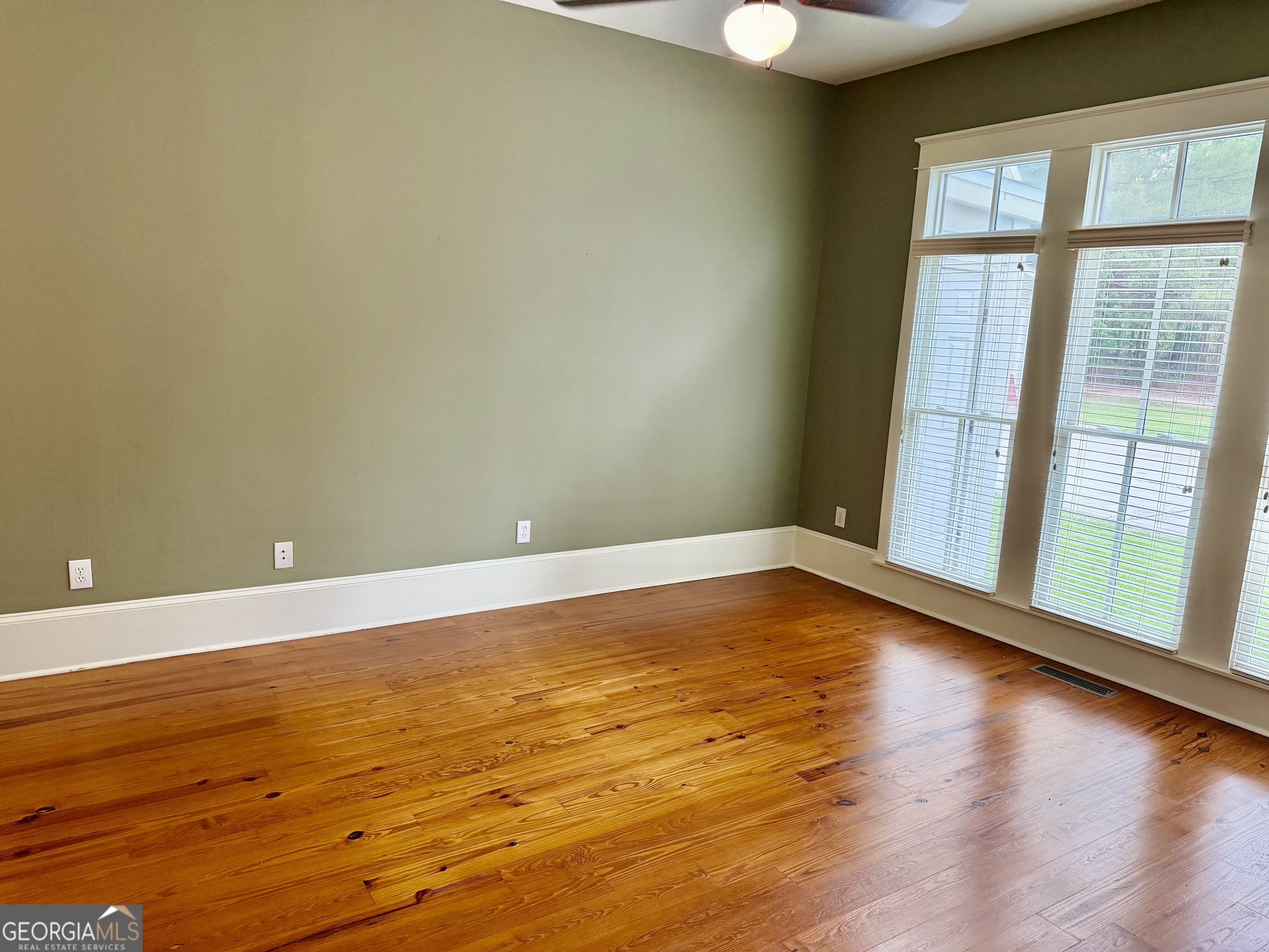 25 Charter Oak Drive Athens, GA 30607 - Photo 12 of 19 a view of an empty room with wooden floor and a window