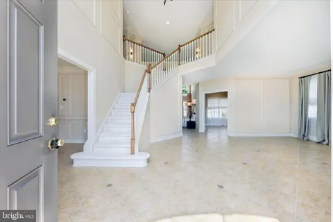 a kitchen with stainless steel appliances granite countertop a stove a refrigerator and a sink
