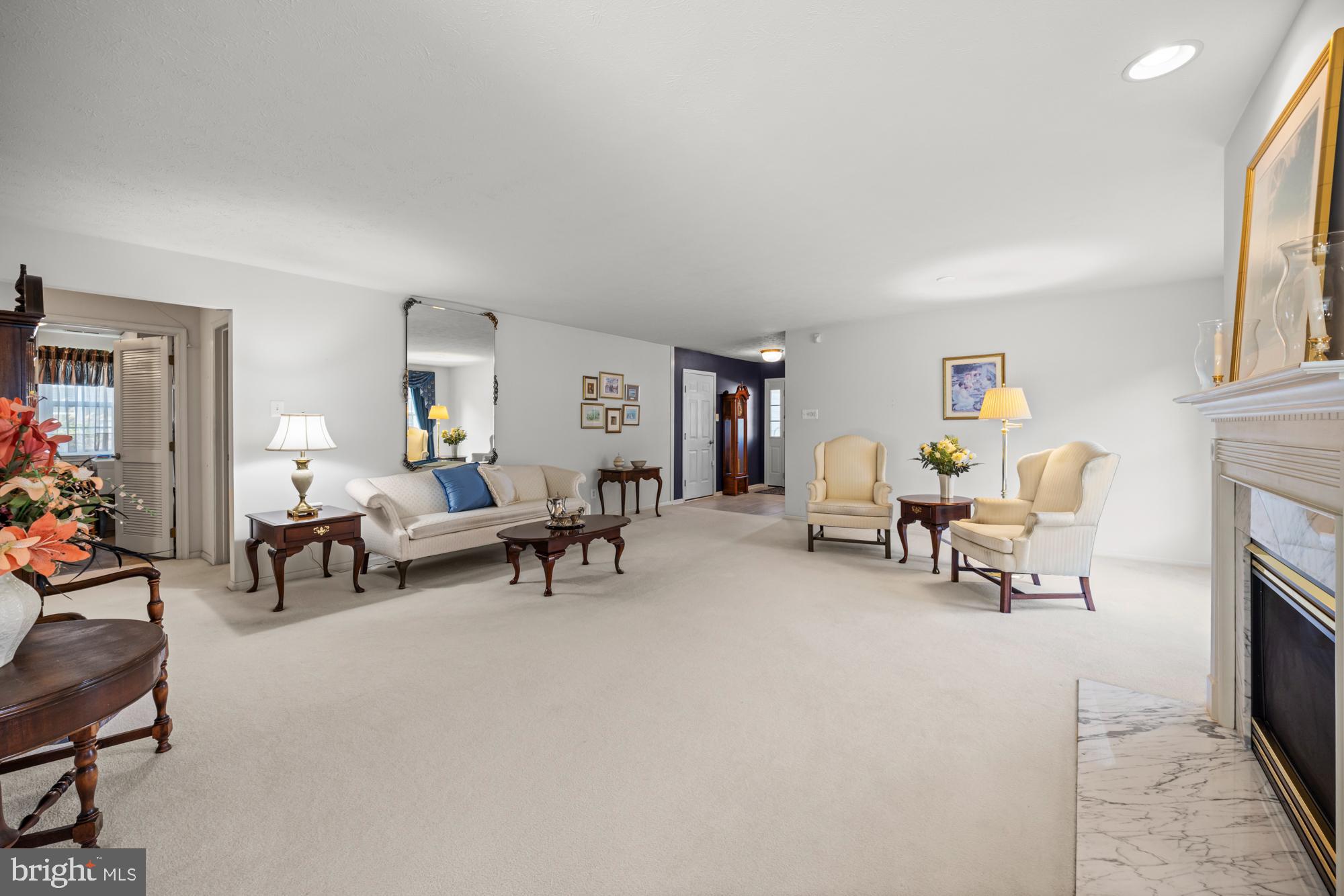 21 Brandon Lane Sewell, NJ 08080 - Photo 11 of 44 a living room with furniture and a fireplace