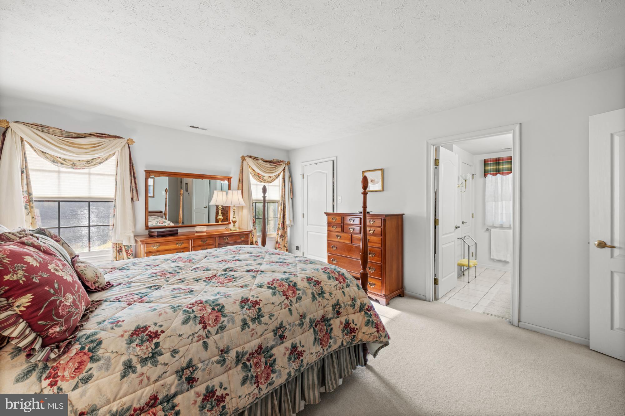 21 Brandon Lane Sewell, NJ 08080 - Photo 18 of 44 a bedroom with a large bed and a chandelier