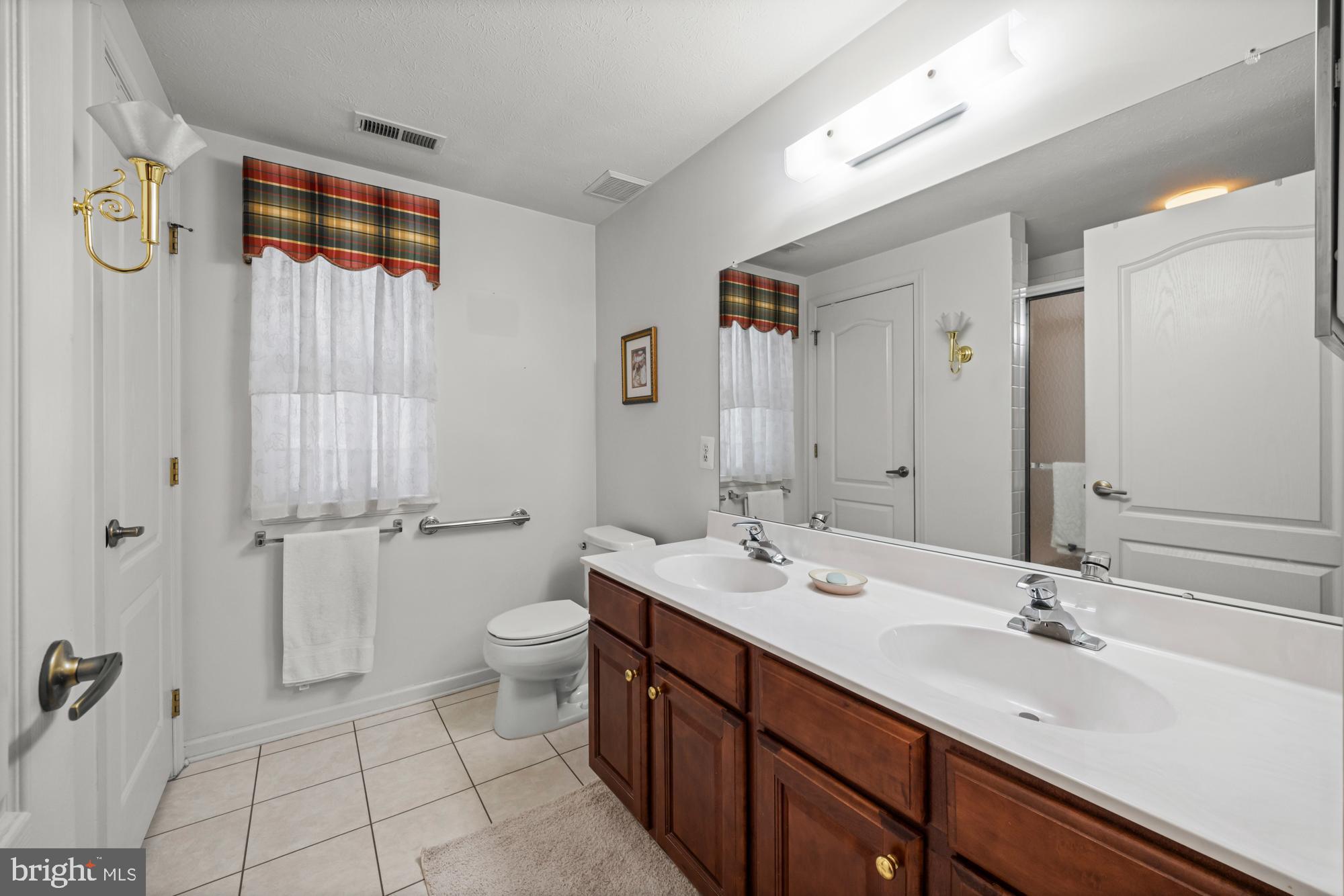 21 Brandon Lane Sewell, NJ 08080 - Photo 20 of 44 a bathroom with a double vanity sink toilet and shower