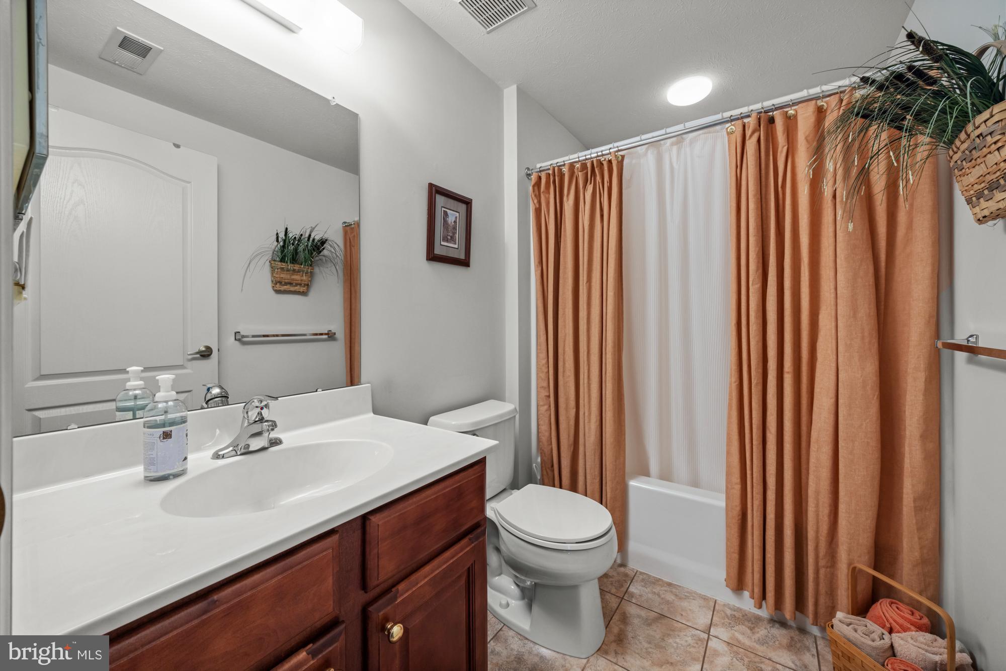 21 Brandon Lane Sewell, NJ 08080 - Photo 22 of 44 a bathroom with a sink a toilet and shower