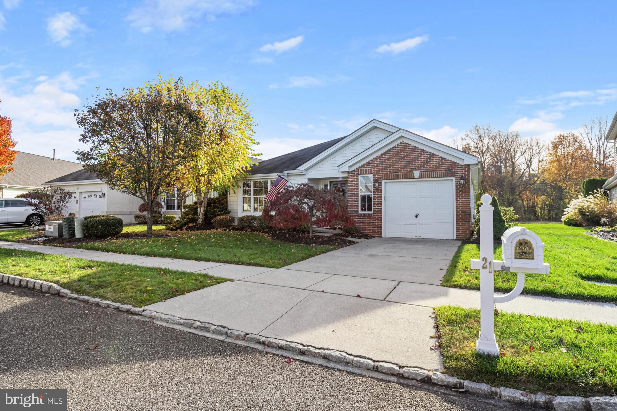 21 Brandon Lane Sewell, NJ 08080 - Photo 38 of 44 a front view of a house with a yard and garage