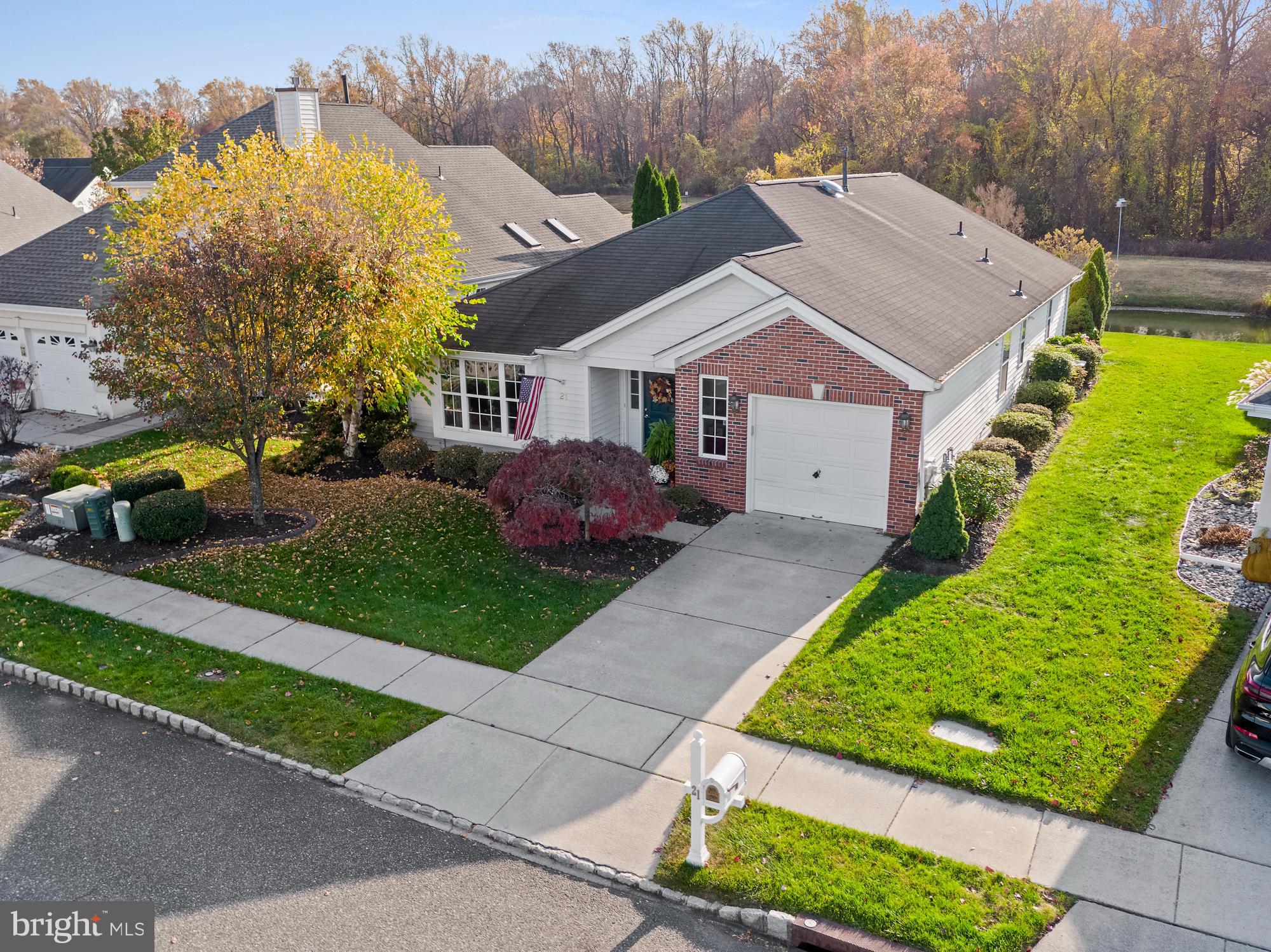21 Brandon Lane Sewell, NJ 08080 - Photo 39 of 44 a aerial view of a house with a yard and potted plants