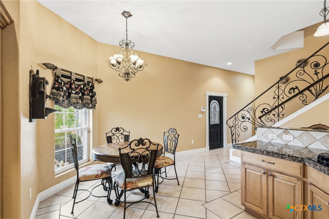 1739 Old Goliad Road Victoria, TX 77905 - Photo 13 of 43 a view of a dining room with furniture and chandelier