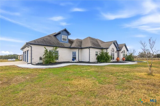 a view of a large pool with an ocean view