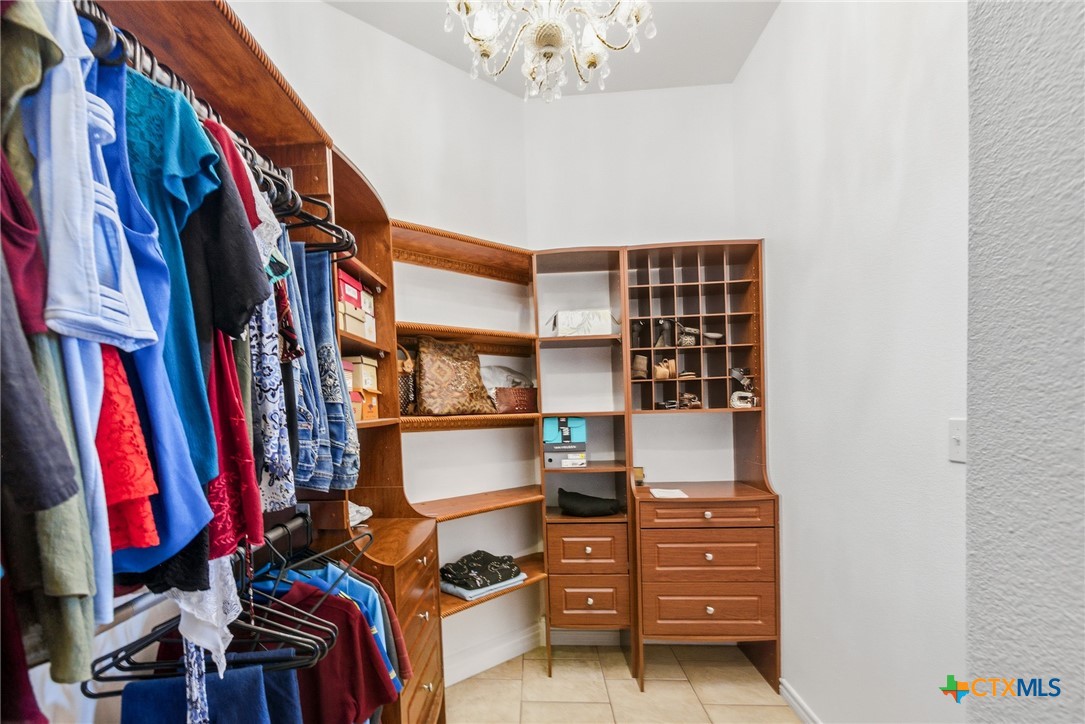 1739 Old Goliad Road Victoria, TX 77905 - Photo 23 of 43 a view of walk in closet with clothes and shoes