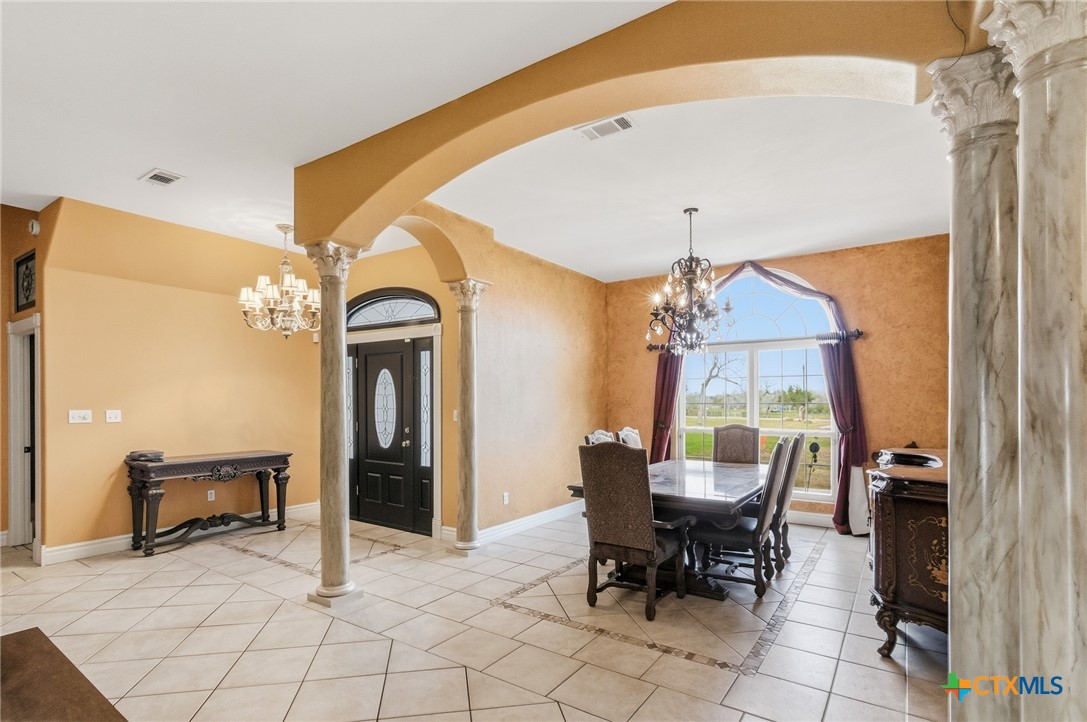1739 Old Goliad Road Victoria, TX 77905 - Photo 6 of 43 a view of a dining room with furniture and chandelier