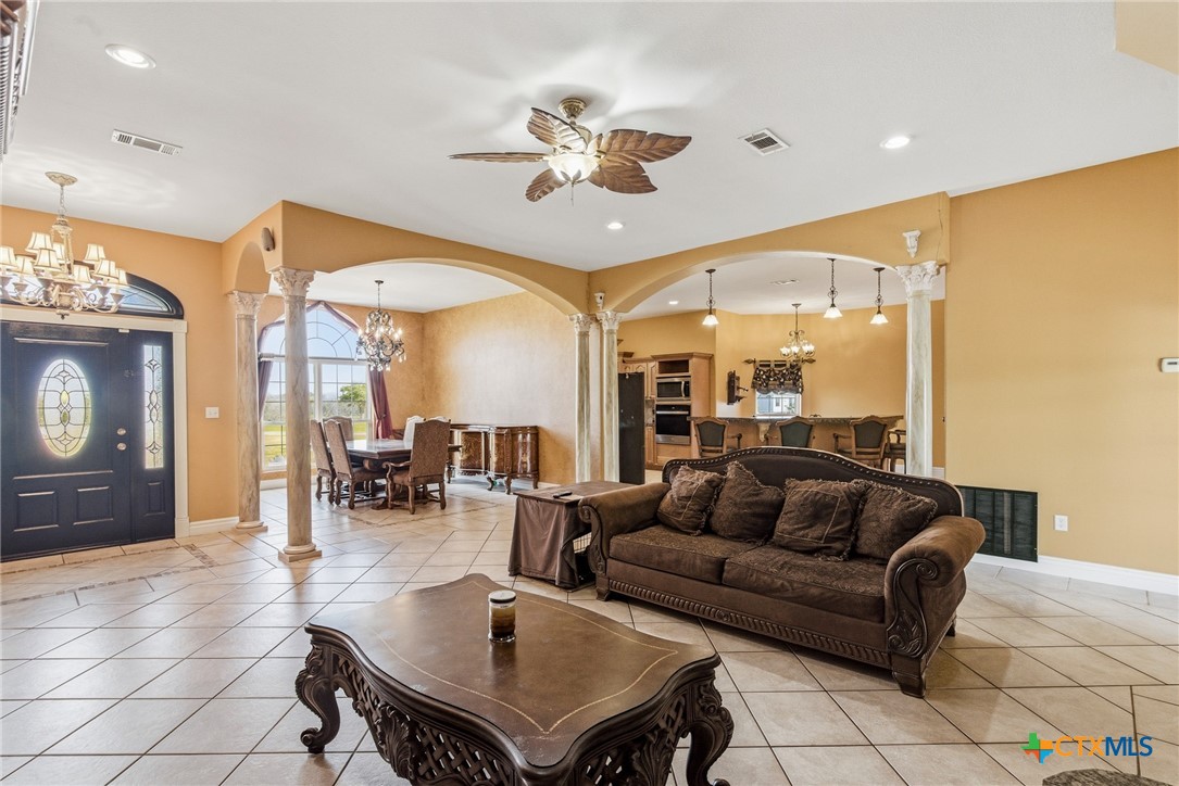 1739 Old Goliad Road Victoria, TX 77905 - Photo 9 of 43 a living room with furniture and a large window