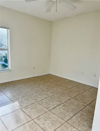 a view of a room that has a large window
