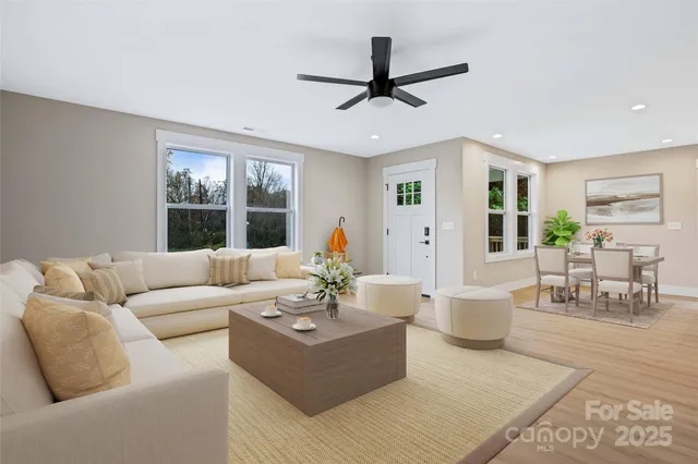 a living room with furniture and a large window