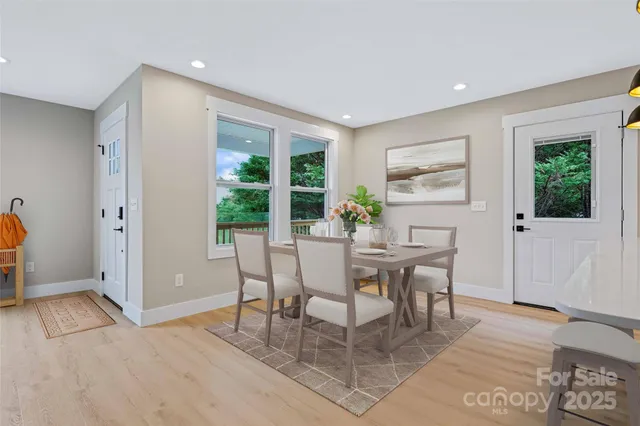 a view of a dining room with furniture window and outside view