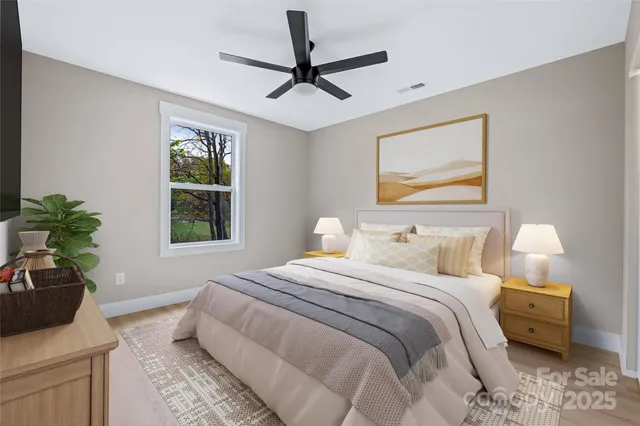 a bedroom with a bed and a window