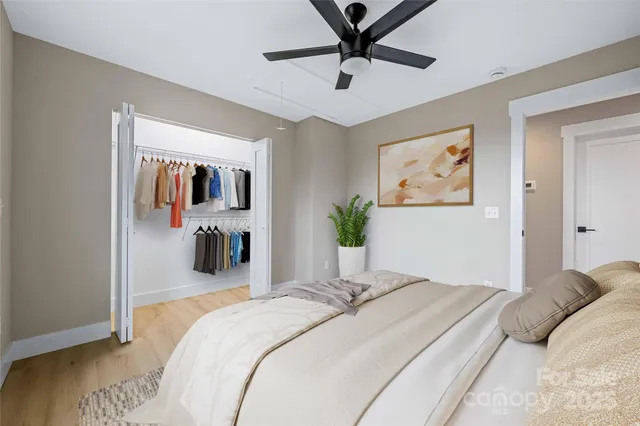 a view of a house with wooden fence