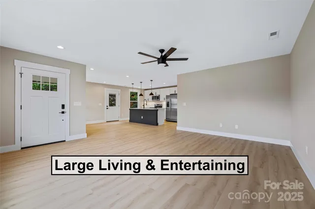 a view of kitchen with furniture and wooden floor