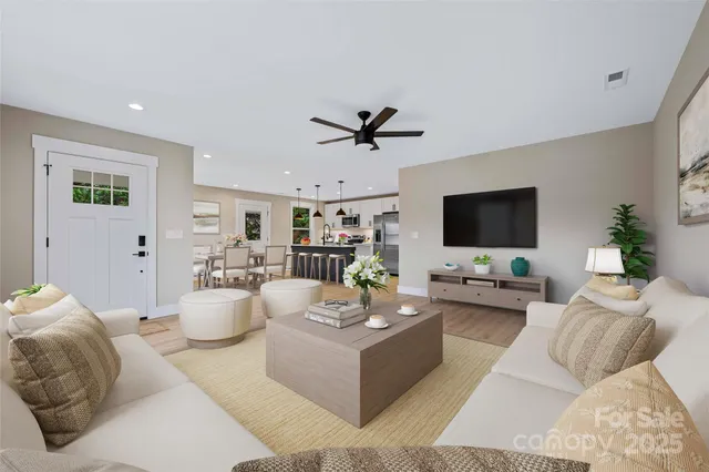 a living room with furniture and a flat screen tv
