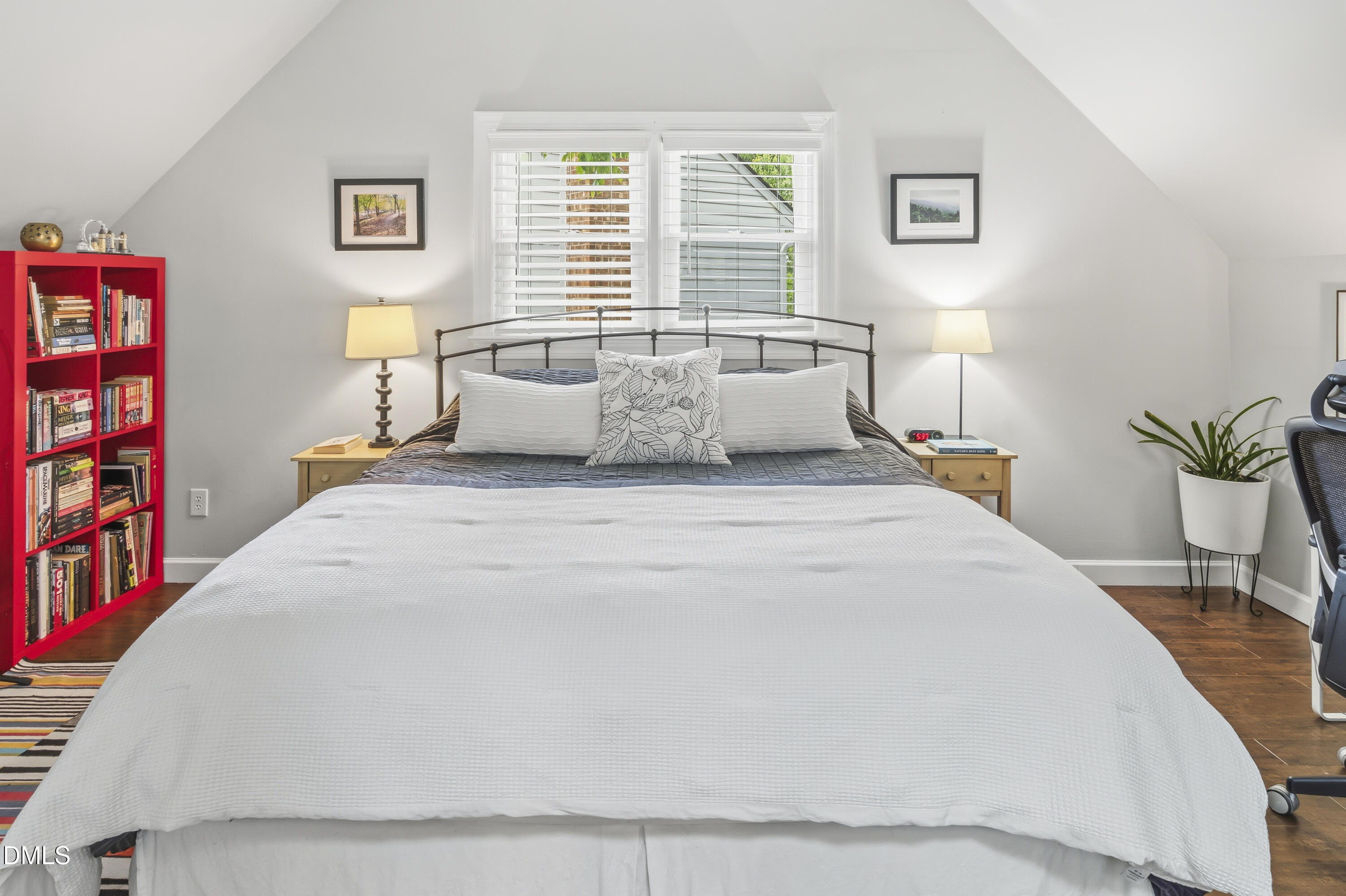 3004 West Annaley Drive Raleigh, NC 27604 - Photo 32 of 44 a large bed sitting in a bedroom next to a window with a potted plant