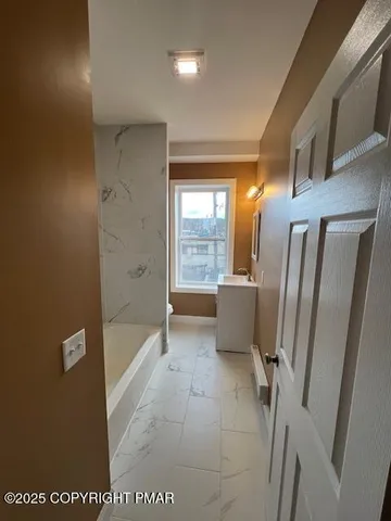 a view of a bathroom with shower