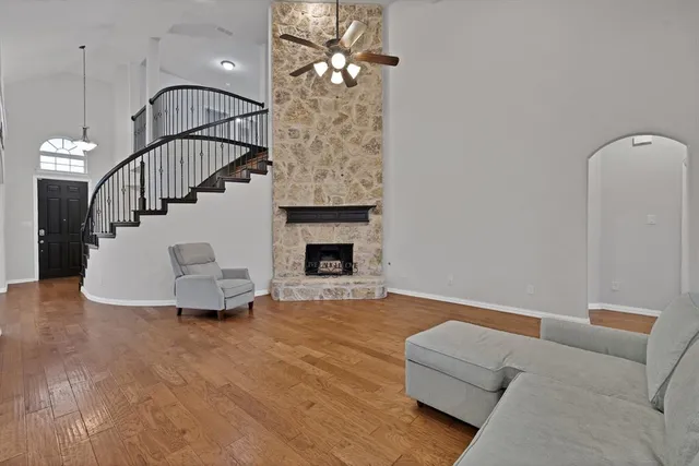 a living room with furniture and a fireplace