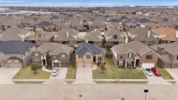an aerial view of residential building and parking space