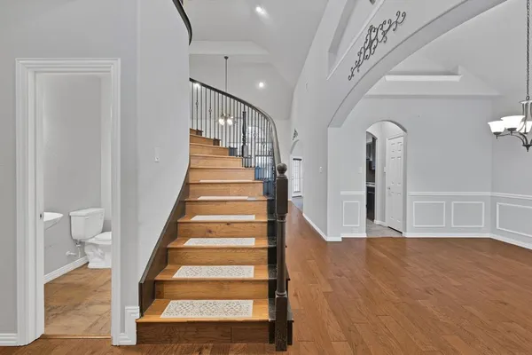 a view of an entryway with wooden floor