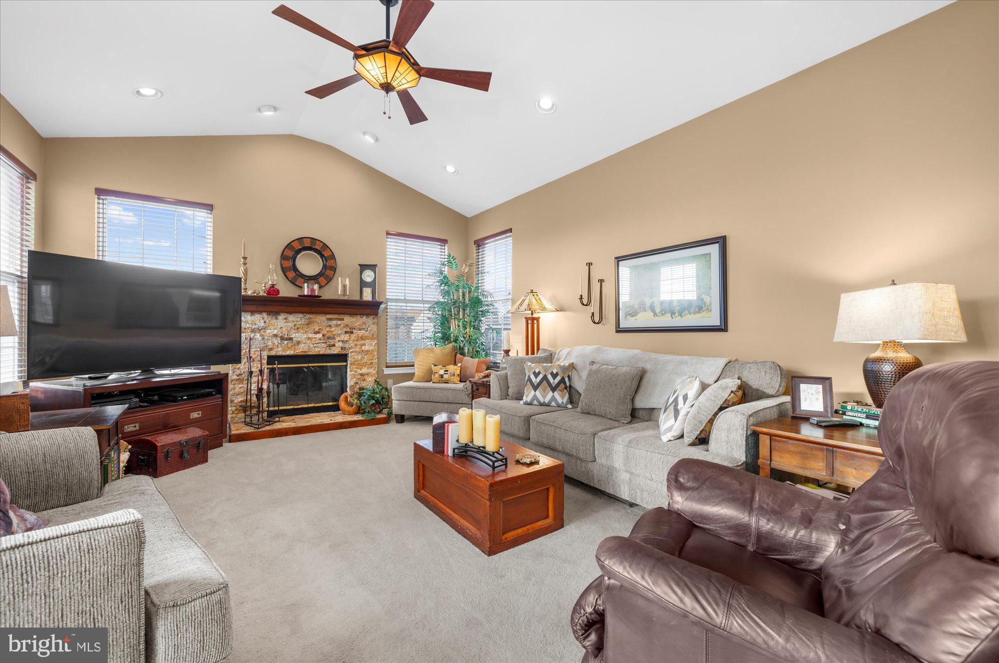 108 Hartman Road Pottstown, PA 19465 - Photo 15 of 38 a living room with furniture a flat screen tv and a fireplace