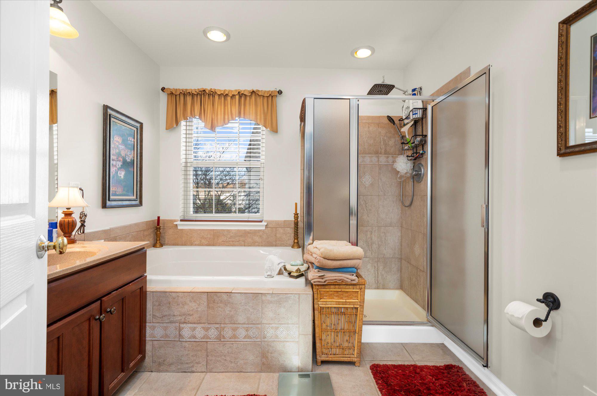108 Hartman Road Pottstown, PA 19465 - Photo 20 of 38 a bathroom with a tub shower sink and mirror