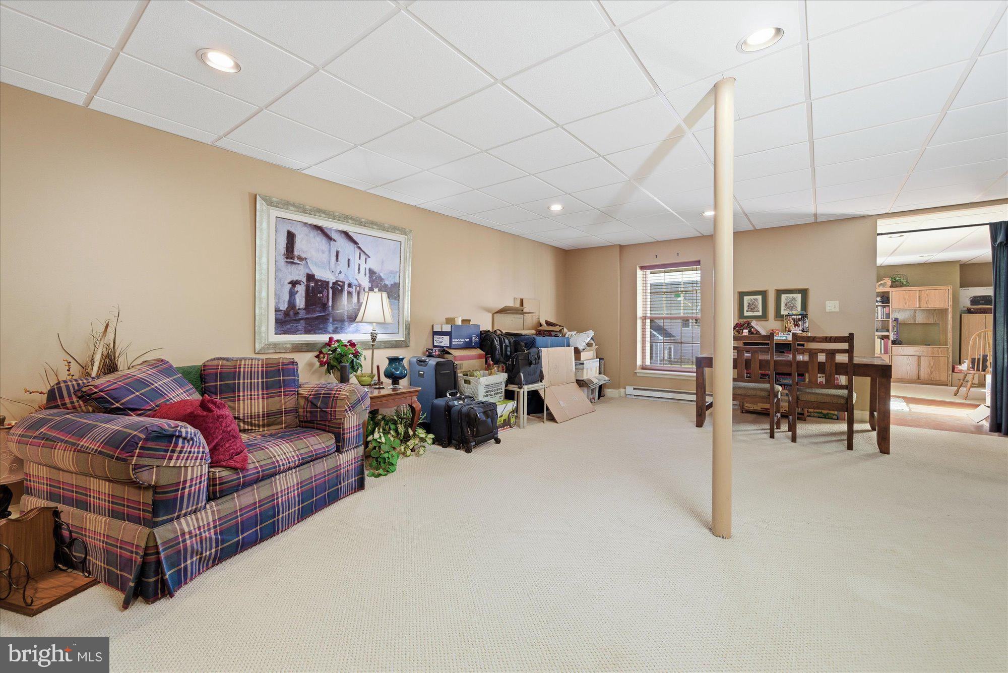 108 Hartman Road Pottstown, PA 19465 - Photo 29 of 38 a living room with furniture and a flat screen tv