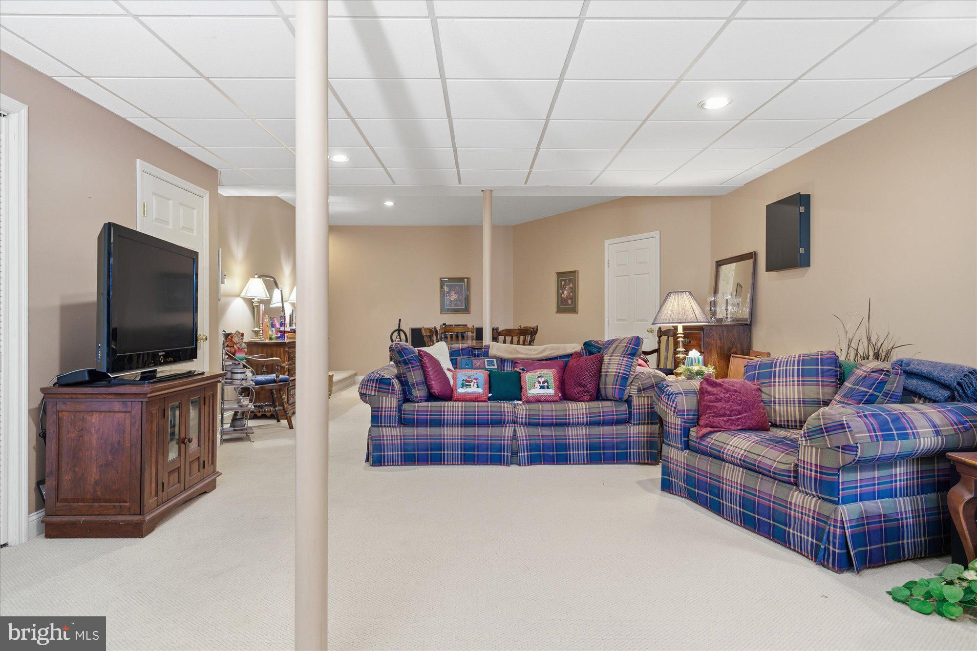 108 Hartman Road Pottstown, PA 19465 - Photo 30 of 38 a living room with furniture and a flat screen tv