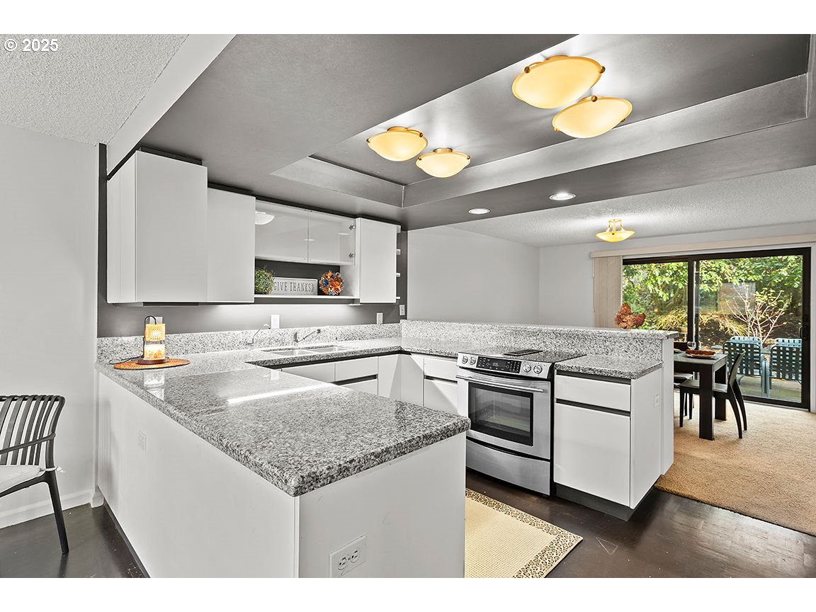9 Britten Court Lake Oswego, OR 97035 - Photo 14 of 48 a kitchen with a stove and a sink