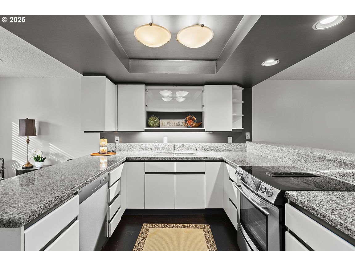 9 Britten Court Lake Oswego, OR 97035 - Photo 15 of 48 a kitchen with a sink stove and cabinets