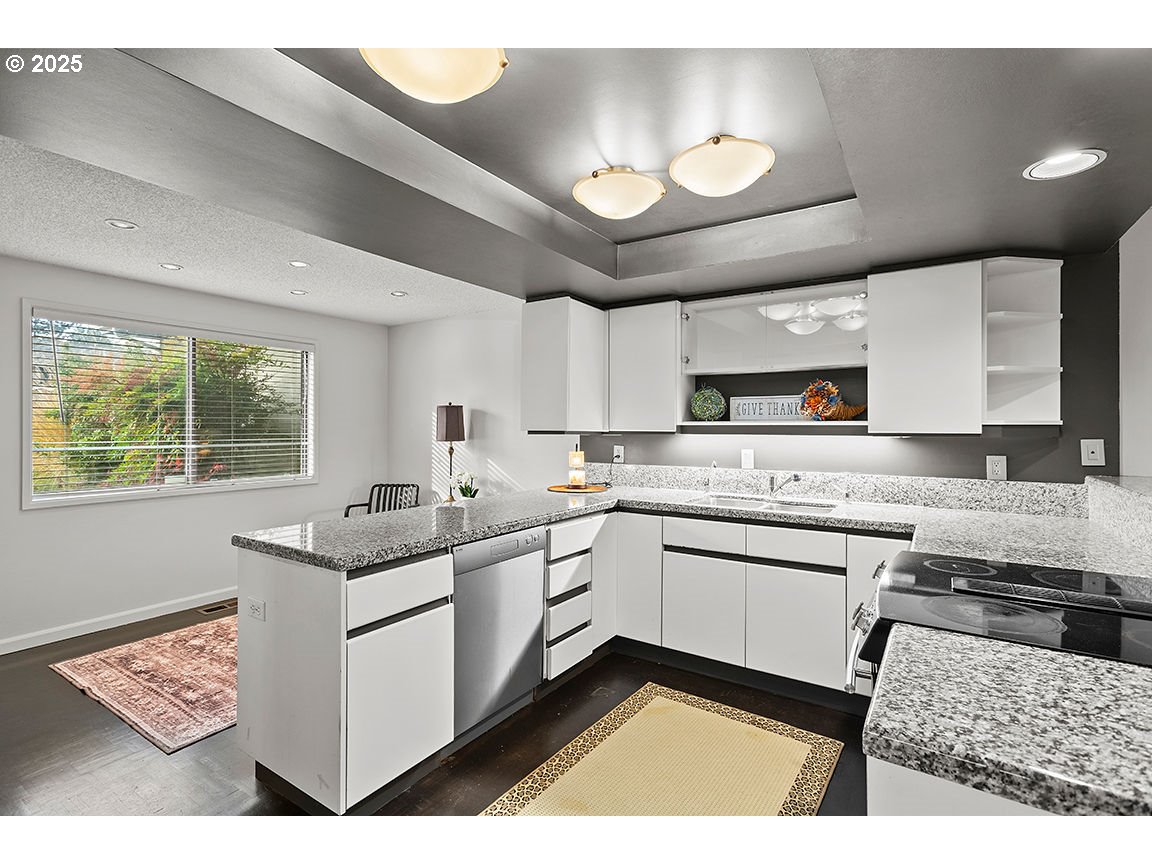 9 Britten Court Lake Oswego, OR 97035 - Photo 16 of 48 a kitchen with a sink and white cabinets